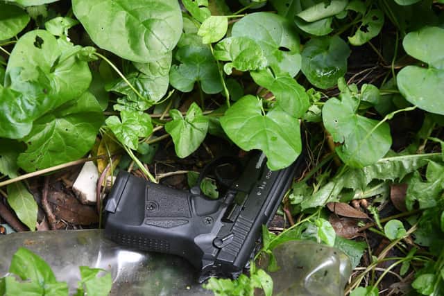 Police found the gun used in the shooting stashed in a flower bed