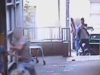 The moment gang member Smye fires in the direction of fleeing men. Photo: Dorset Police