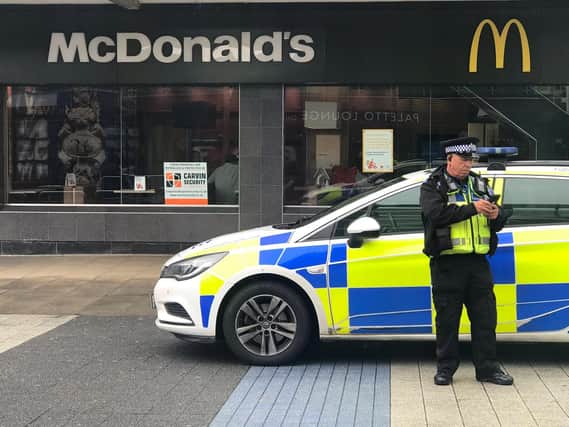 Police officers arrested the men outside Corby town centre McDonald's