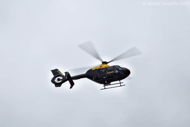 Police helicopter was scrambled to help search for the fleeing suspects. Photo Jensen Houghton