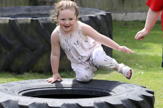 Penny, 3, in the garden