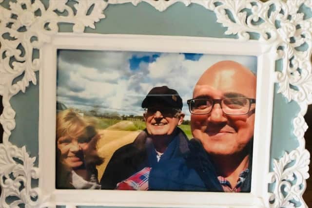 Louise (left) with her husband Trevor (middle) and son Wayne (right).
