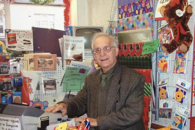 JIm Osborne behind the counter of his toy and sports shop