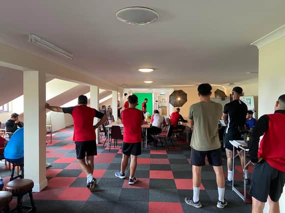 The Kettering Town players carried out various media duties before they took part in an open training session at Latimer Park on Saturday