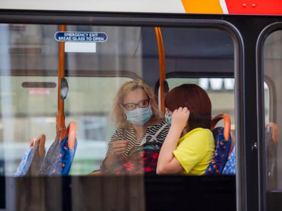 Face masks are required on buses and trains  and should be worn when sharing car trips, too