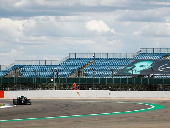 Lewis Hamilton on his way to victory in front of empty grandstands at Silverston. Photo: Getty Images