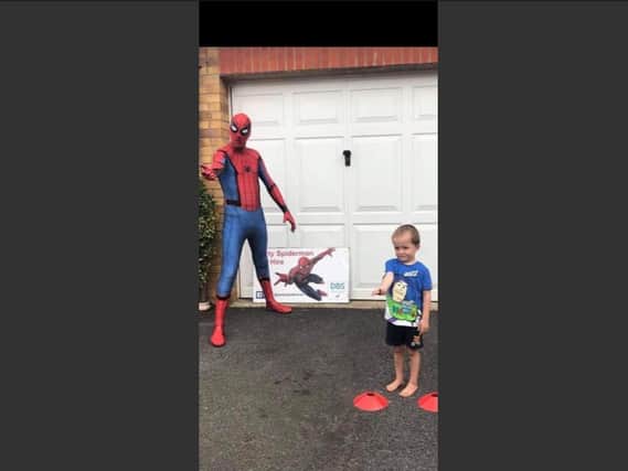 Carter-Lewis, 5, with Spiderman at his fifth birthday last month