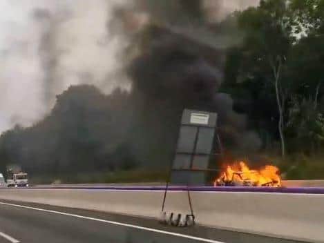 Dashcam footage shows the blazing vehicle on the M1