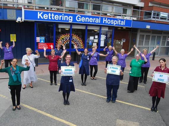 Members of Kettering General Hospitals clinical, housekeeping and infection prevention and control teams celebrate being MRSA bacteraemia free for five years.