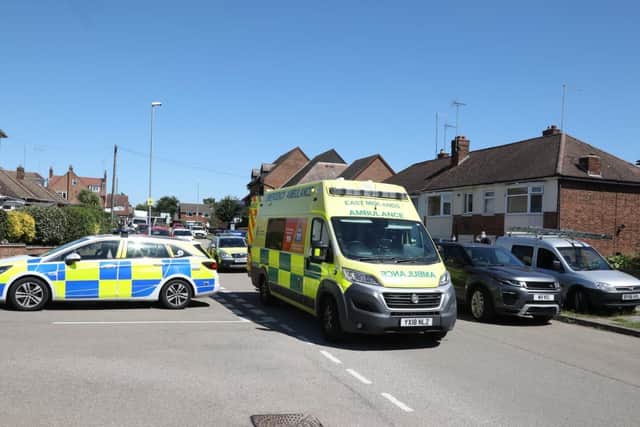 There are two ambulances, a paramedic ambulance, police and an air ambulance at the scene.