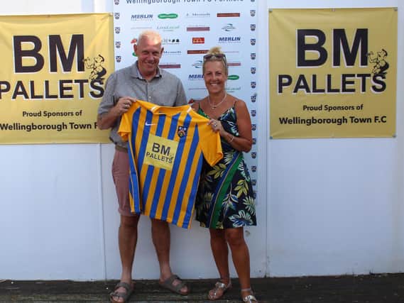BM Pallets managing director Brian Martin and his wife Sarah show off Wellingborough Towns home shirt after his sponsorship deal with the club