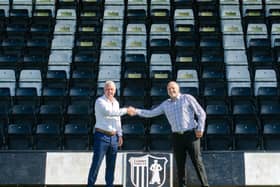 New Corby Town manager Gary Mills (left) and assistant Darron Gee shake on it after they arrived at Steel Park last weekend. Picture by Chelsea Aves-Darrah