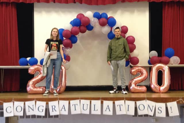 Adam and Daisy celebrate their results.
