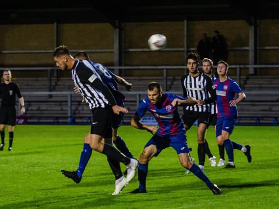 Action from Corby Town's 1-0 win at Leicester Road as Gary Mills enjoyed a winning start to life as manager. Pictures by Jim Darrah