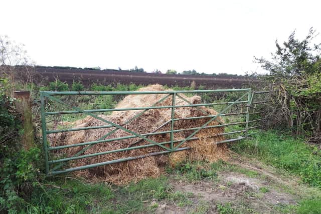 Piles of manure have been used to block gateways along Hardwater Road between Wollaston and Great Doddington