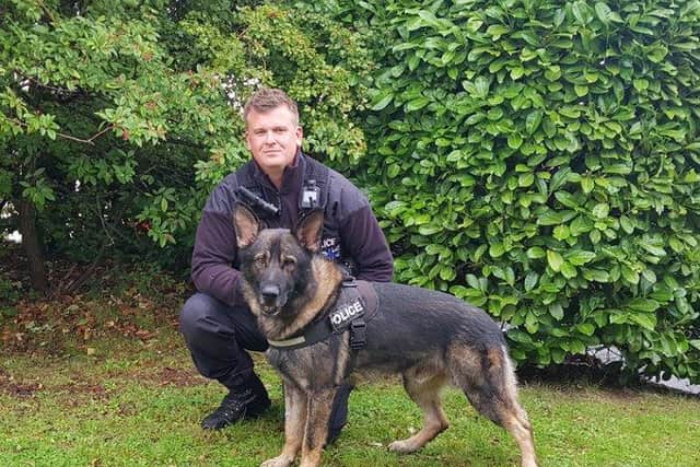 Newly-licensed PD Boycie with his handler PC Alex Willatt. Photo: Northamptonshire Police