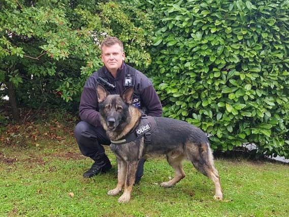 Newly-licensed PD Boycie with his handler PC Alex Willatt. Photo: Northamptonshire Police