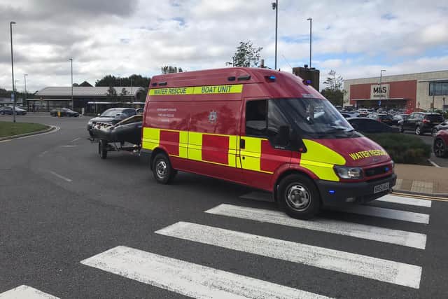 There was a big emergency response to help a woman stuck in the water at Rushden Lakes. Photo Northamptonshire Fire and Rescue
