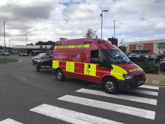 There was a big emergency response to help a woman stuck in the water at Rushden Lakes. Photo Northamptonshire Fire and Rescue