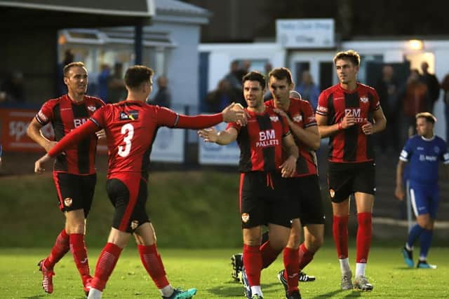 Dan Holman takes the congratulations after his long-range strike gave Kettering the lead in their friendly at Halesowen