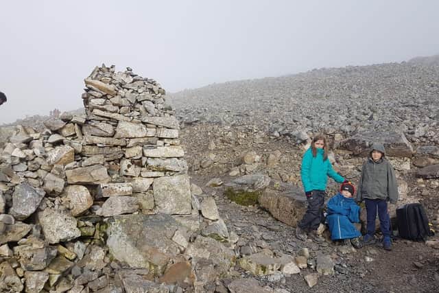 Caeden, seven, at the top of Ben Nevis with sister Khya, ten, eight-year-old brother Ashton