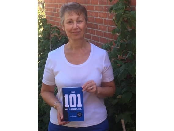 Kim Grove with her book.