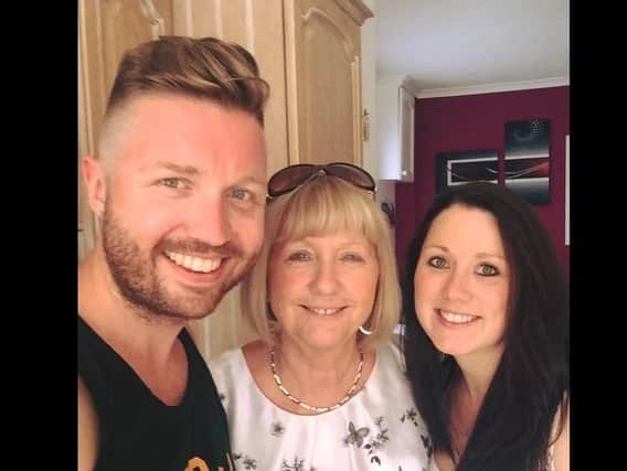 Marion (centre) with her son Gary and daughter Toni