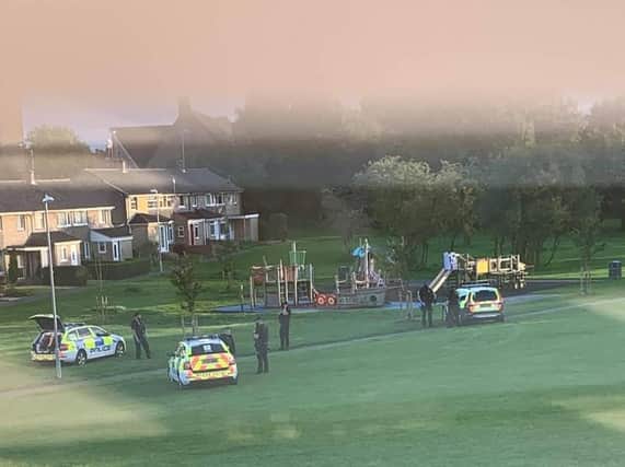 Ollerton Play area with three police cars and numerous officers on the scene as the arrests were made. Photo Credit: Louise Collins.