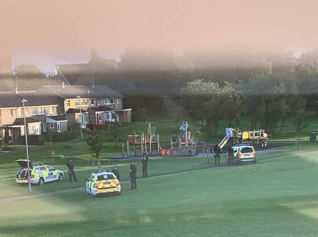 Ollerton Play area with three police cars and numerous officers on the scene as the arrests were made. Photo Credit: Louise Collins.