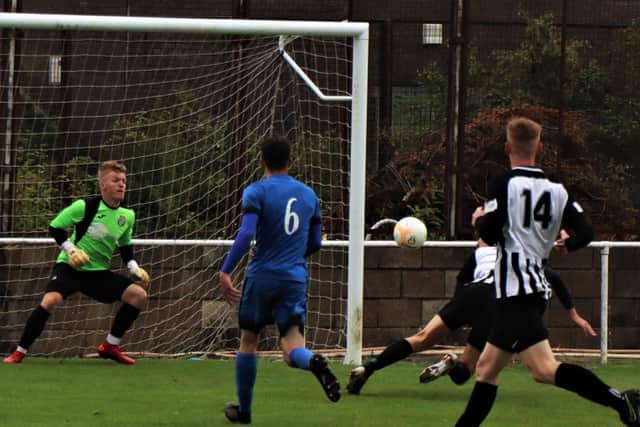 Corby Town have enjoyed a successful pre-season with four wins from as many friendlies including a 9-1 success at Desborough Town in which Elliot Sandy (partly hidden) scored four goals. Picture by David Tilley