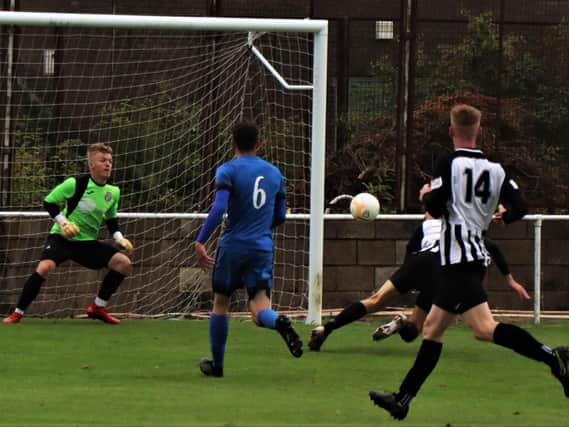 Corby Town have enjoyed a successful pre-season with four wins from as many friendlies including a 9-1 success at Desborough Town in which Elliot Sandy (partly hidden) scored four goals. Picture by David Tilley
