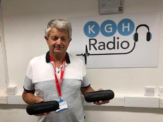John Radford, a fundraiser at KGH Radio, with speakers donated by Mulberry Homes