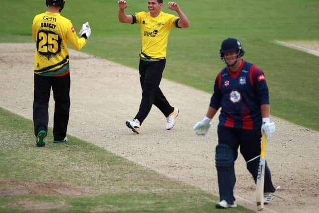 Graeme van Buuren celebrates the dismissal of Richard Levi
