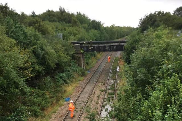 Network Rail workers inspect the line at Corby
