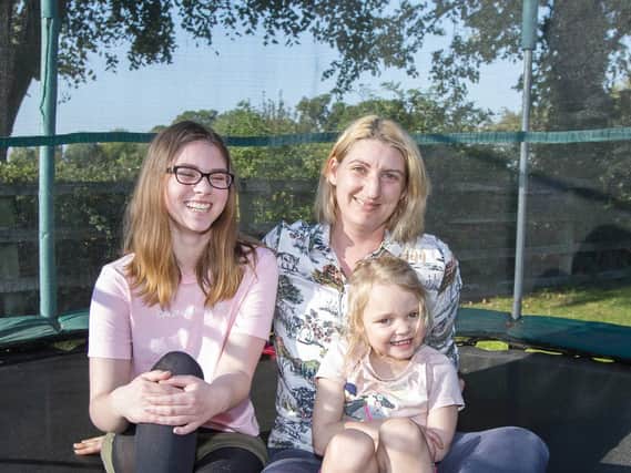 Amiee (left) is having to miss school because the local authority has not provided the transport she is entitled to.  Pictured with her mum Louise and sister Harriet.
