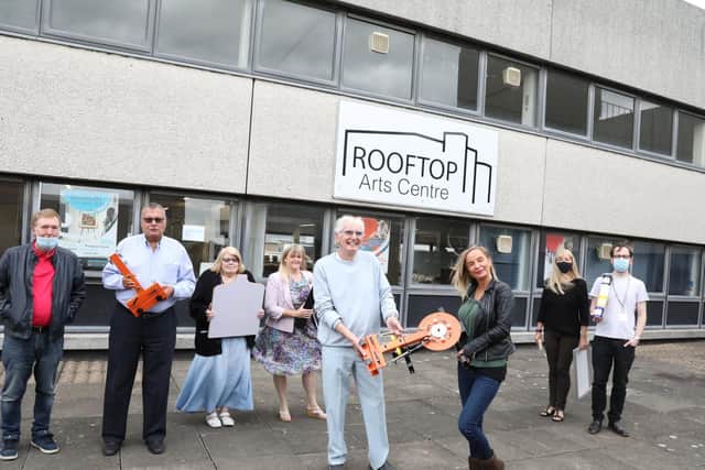 Members of Oakley Vale Community Association with chairman Paul Balmer and Rooftop Arts Centre presentation of screen printing machine