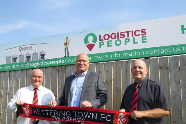 Kettering Town chairman David Mahoney (left), Logistics People managing director Carl Stairs (centre) and Poppies director Gary Graham pictured outside Latimer Park after a new sponsorship deal was agreed. Picture courtesy of Kettering Signs
