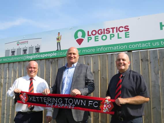 Kettering Town chairman David Mahoney (left), Logistics People managing director Carl Stairs (centre) and Poppies director Gary Graham pictured outside Latimer Park after a new sponsorship deal was agreed. Picture courtesy of Kettering Signs