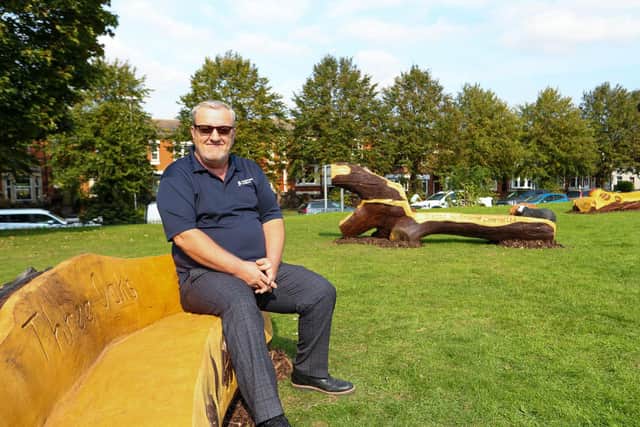 Highways England Construction Assurance Manager Dave Marlow tries out one of the three benches which have been created for the local community