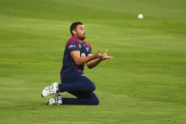Nathan Buck takes a catch to dismiss Will Smeed