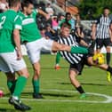 Jordon Crawford tries to get a shot on goal during Corby Town's 1-0 defeat to Aylesbury United on the opening day of the league season. Pictures by Jim Darrah