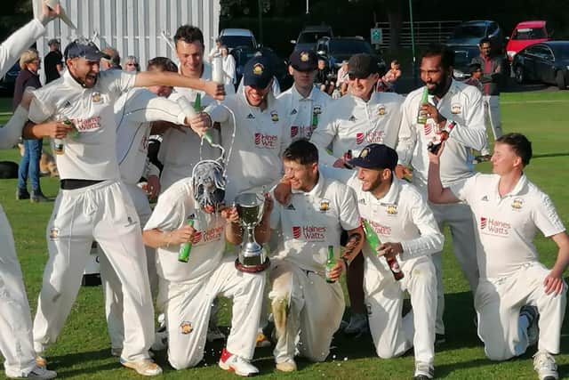 The Loddington & Mawsley players savour the moment after their one-wicket win over Stony Stratford in the Division One final