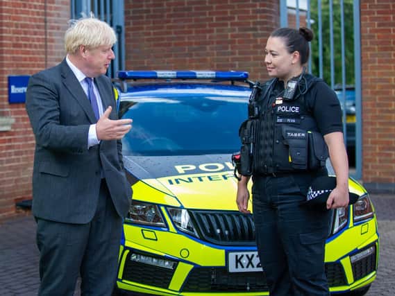 The Prime Minister chats with  PC Charlotte Jones during his visit to Northants Police HQ