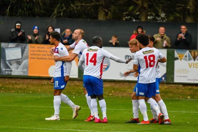Luke Fairlamb, far left, takes the congratulations along with goalscorer Matty Slinn after the winger set up the midfielder for AFC Rushden & Diamonds' equaliser in the 1-1 draw with Barwell. Pictures courtesy of HawkinsImages