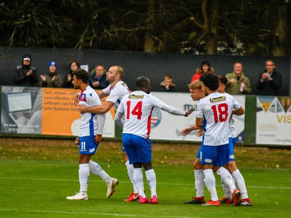 Luke Fairlamb, far left, takes the congratulations along with goalscorer Matty Slinn after the winger set up the midfielder for AFC Rushden & Diamonds' equaliser in the 1-1 draw with Barwell. Pictures courtesy of HawkinsImages