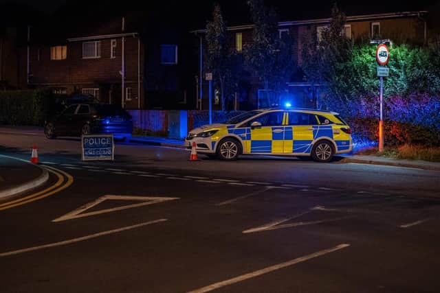 Police at the scene in Burton Latimer. Photo: JCM