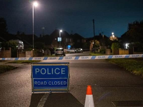 Police cordoned off areas of Burton Latimer last night after the incident. Photo: JCM
