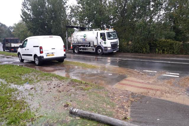 The burst mains in Barton Road by the bridge near Wicksteed Park