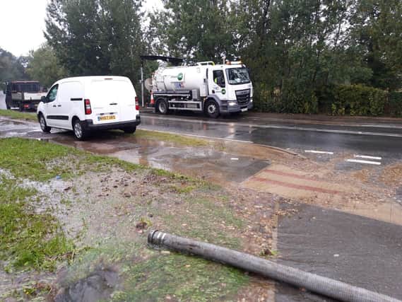 The burst mains in Barton Road by the bridge near Wicksteed Park
