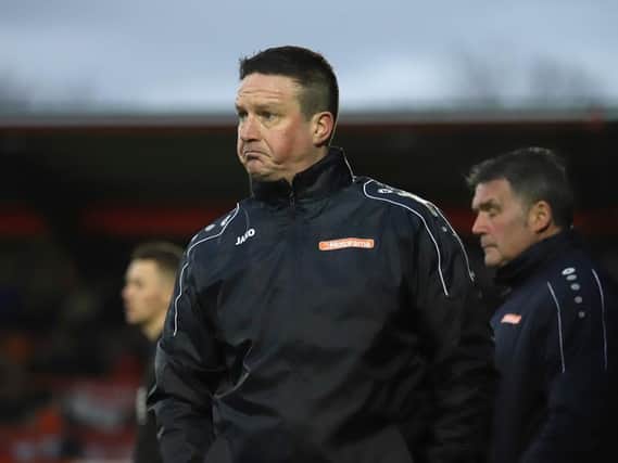 Kettering Town manager Paul Cox and his players will kick off their season at a virtually empty Latimer Park this weekend